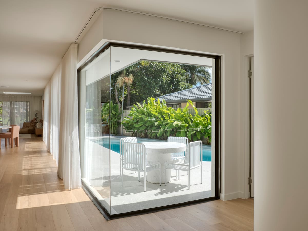 A modern Gold Coast home with floor-to-ceiling glass and a poolside outlook